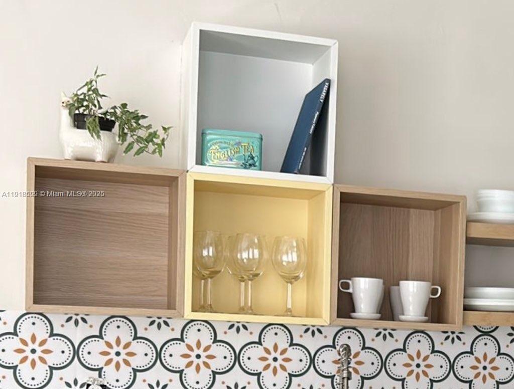 801 8th Street, Unit 201 Miami Beach, FL 33139 - Photo 11 of 37 a view of a door and chair in a room