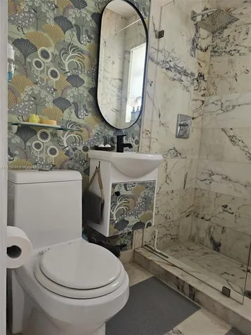 a bathroom with a toilet and a sink