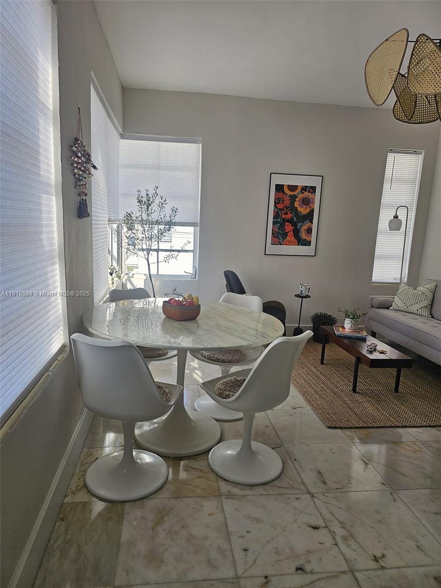 801 8th Street, Unit 201 Miami Beach, FL 33139 - Photo 3 of 37 a view of a dining room with furniture
