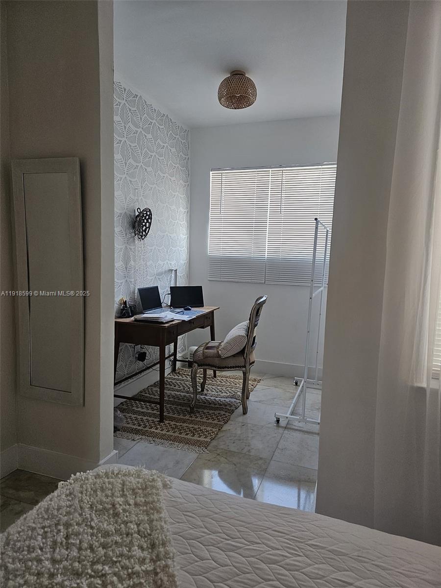 801 8th Street, Unit 201 Miami Beach, FL 33139 - Photo 32 of 37 a view of a livingroom and a dining room with wooden floor