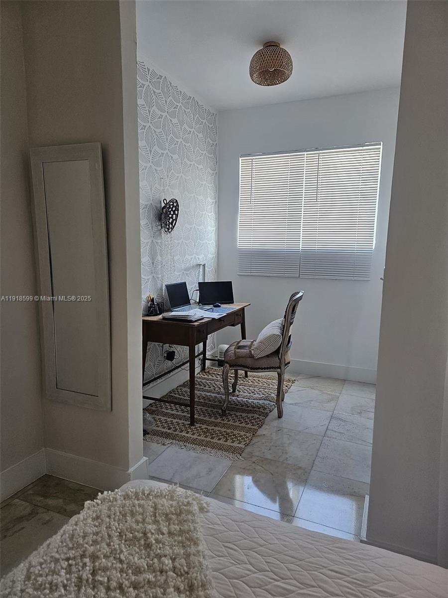 801 8th Street, Unit 201 Miami Beach, FL 33139 - Photo 33 of 37 a living room with furniture and a window