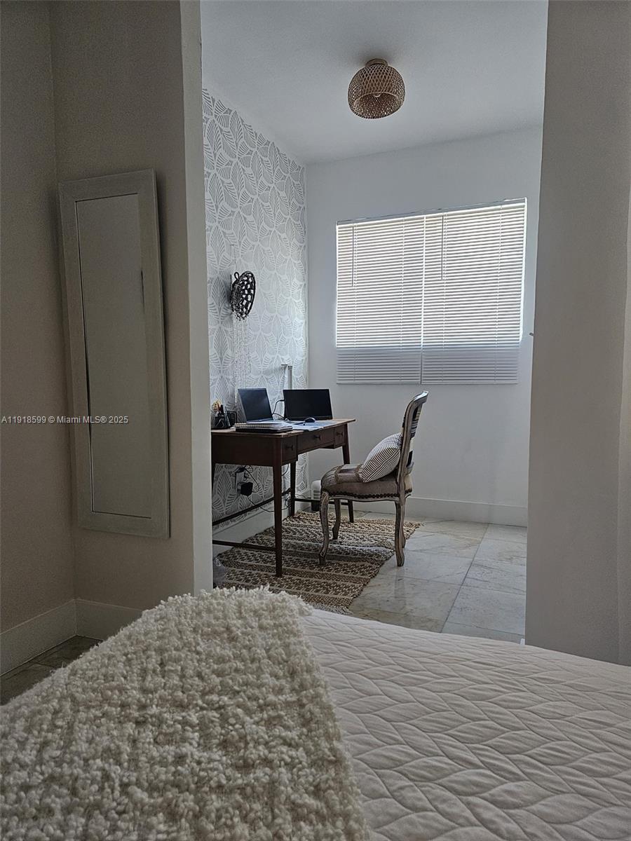 801 8th Street, Unit 201 Miami Beach, FL 33139 - Photo 34 of 37 a bedroom with a bed and a window
