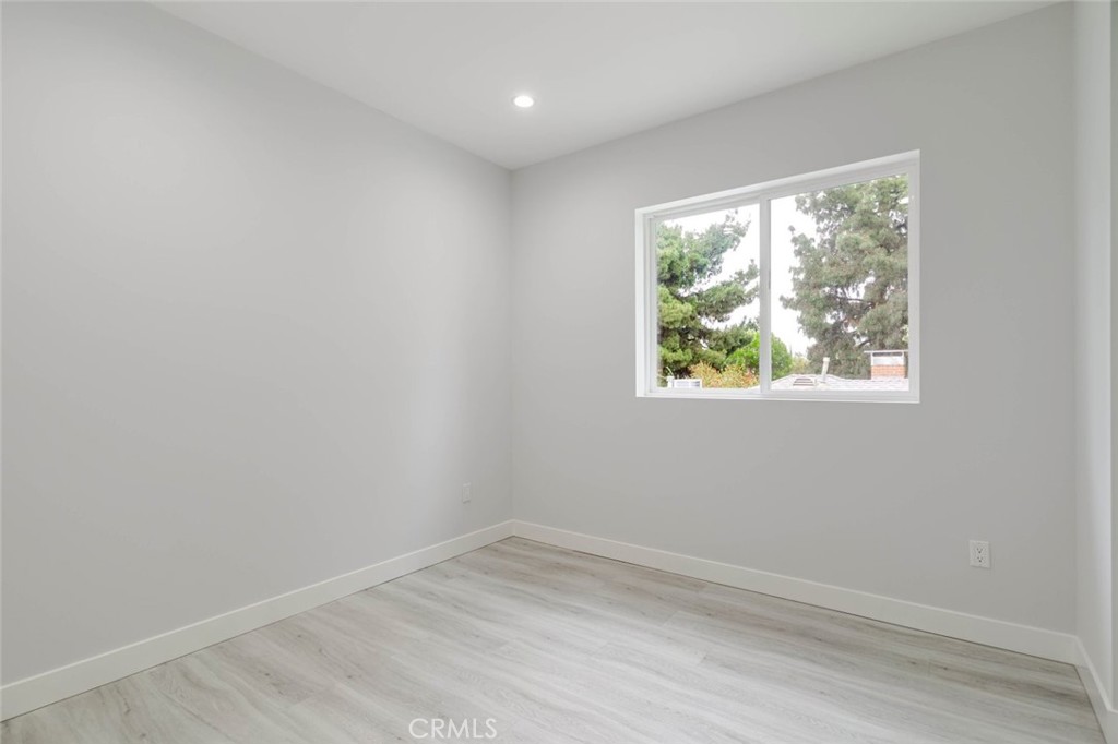 9035 Rathburn Avenue, Unit 1/2 Northridge, CA 91325 - Photo 16 of 25 an empty room with a window