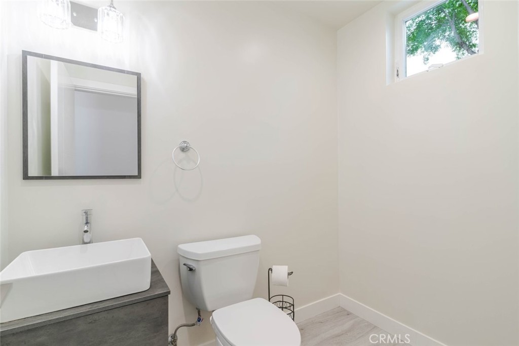 9035 Rathburn Avenue, Unit 1/2 Northridge, CA 91325 - Photo 18 of 25 a white toilet sitting next to a white sink