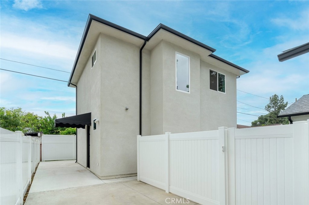 9035 Rathburn Avenue, Unit 1/2 Northridge, CA 91325 - Photo 2 of 25 a front view of a house with stairs