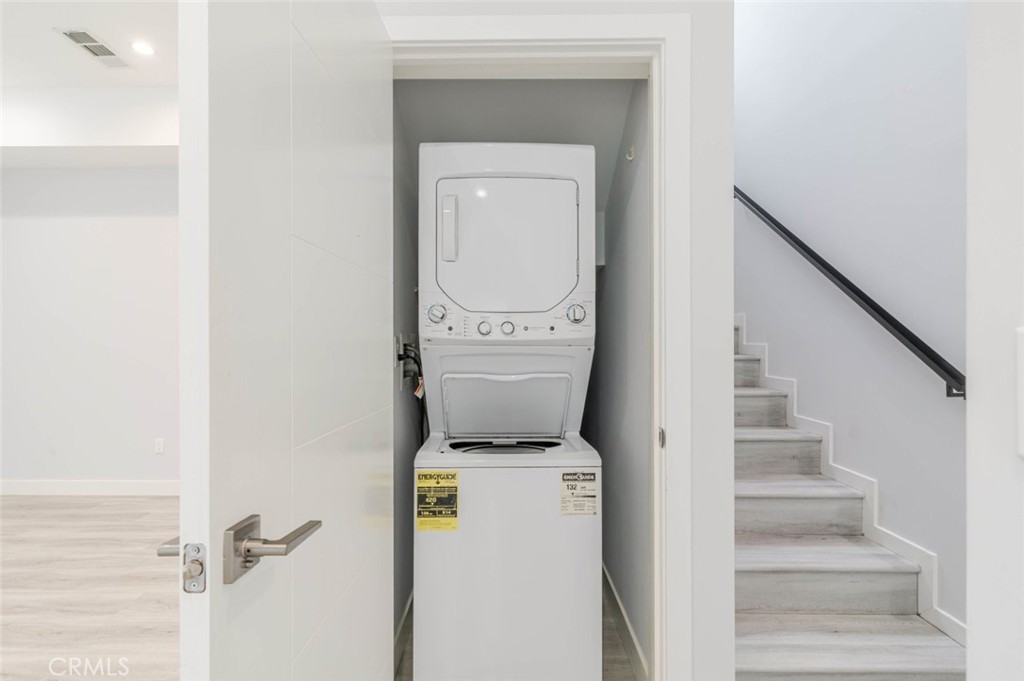 9035 Rathburn Avenue, Unit 1/2 Northridge, CA 91325 - Photo 21 of 25 a utility room with dryer and washer