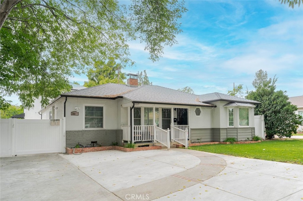 9035 Rathburn Avenue, Unit 1/2 Northridge, CA 91325 - Photo 24 of 25 a front view of a house with a garden