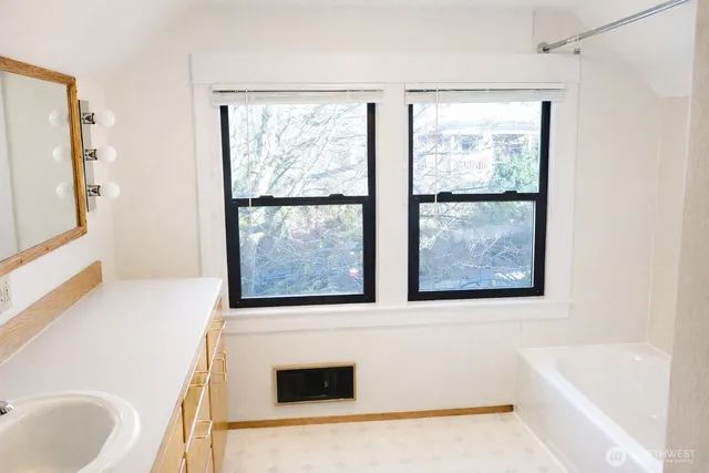 a bathroom with a toilet and a bathtub