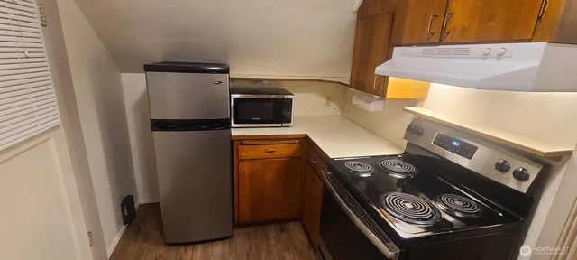 a close view of stove and refrigerator