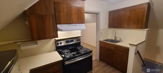 a kitchen with a stove and a microwave