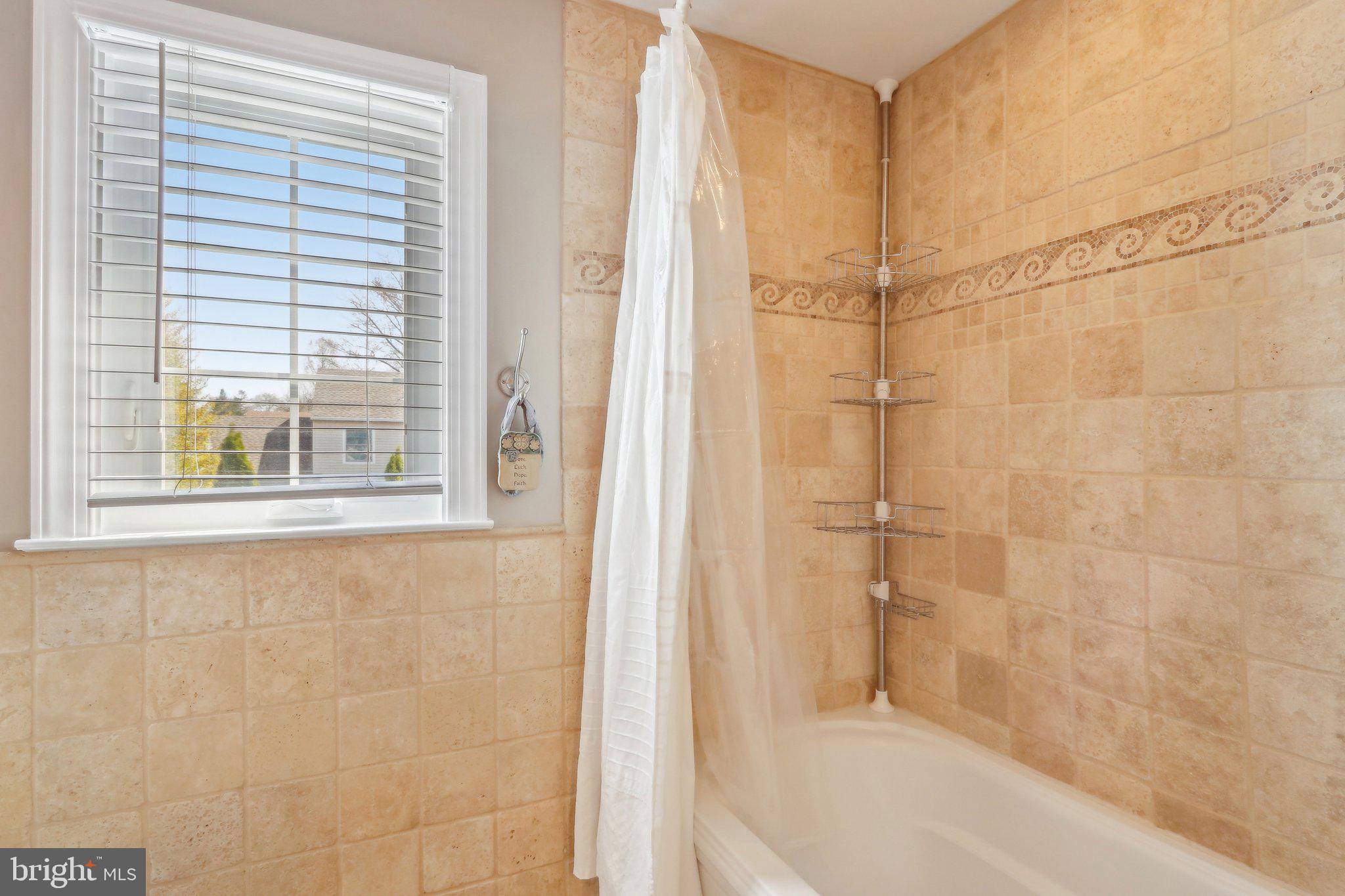 23 Yale Road Marlton, NJ 08053 - Photo 28 of 42 a bathroom with a bathtub and a shower