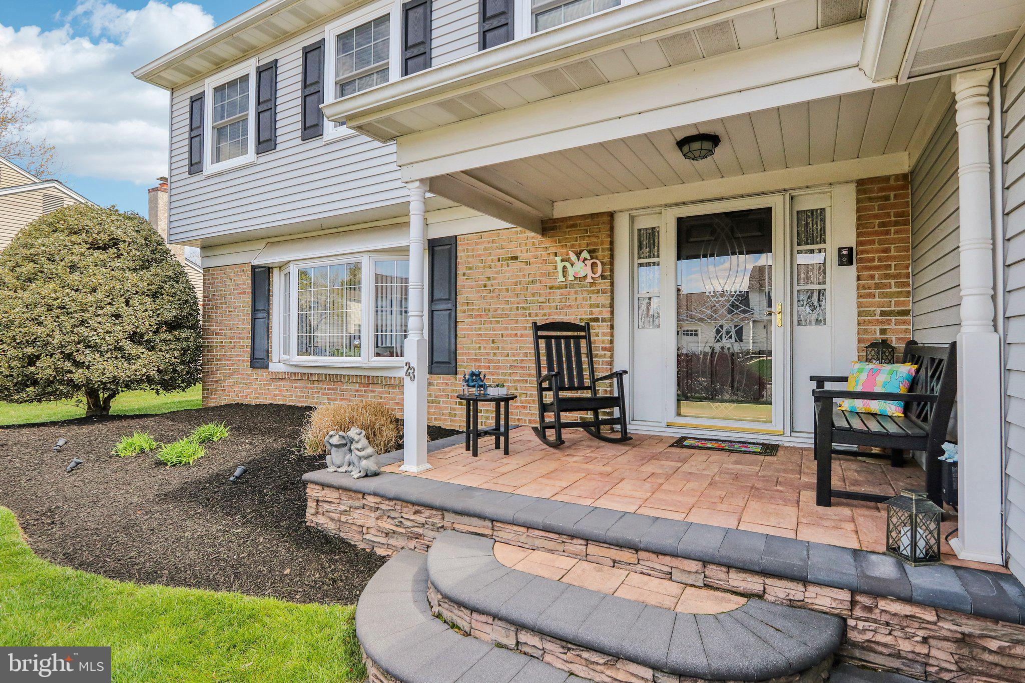 23 Yale Road Marlton, NJ 08053 - Photo 4 of 42 front view of a house with a chairs and table in a patio