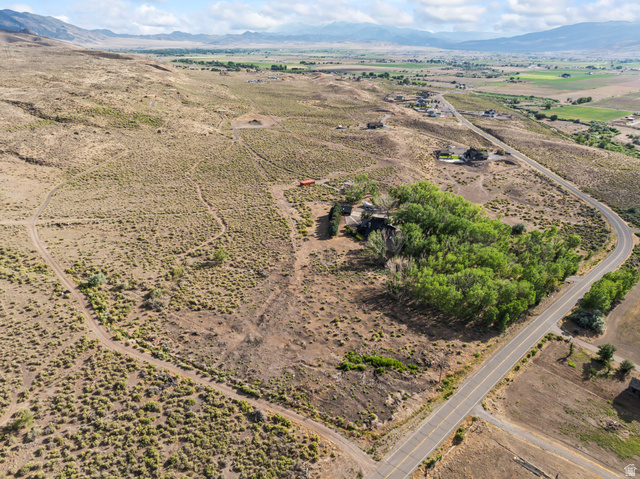 460 Omni Point Road Central Valley, UT 84754 - Photo 91 of 101 Extensive land parcel featuring established trees and a paved road frontage