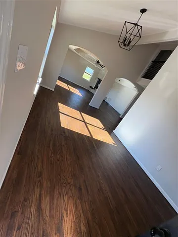 a kitchen with a sink a stove and cabinets