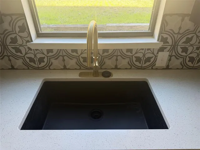 wooden floor in an empty room with a stove