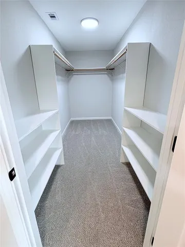 a view of an empty room with a fireplace