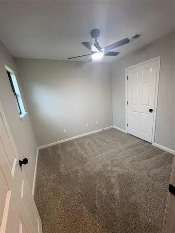 a large kitchen with stainless steel appliances kitchen island granite countertop a sink a stove and a refrigerator