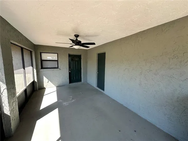 a view of a hallway with a livingroom