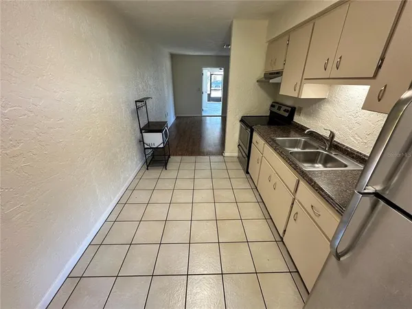 a kitchen with a sink and cabinets