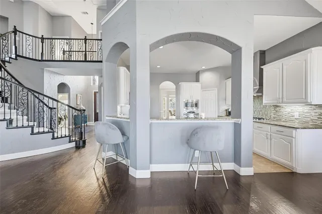 a view of living room and dining room with wooden floor