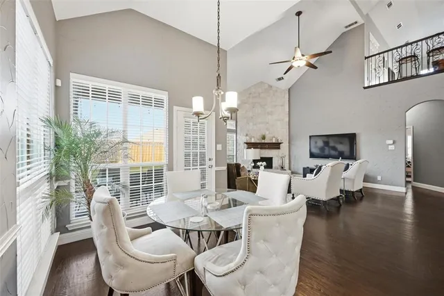 a living room with couches a coffee table and a flat screen tv