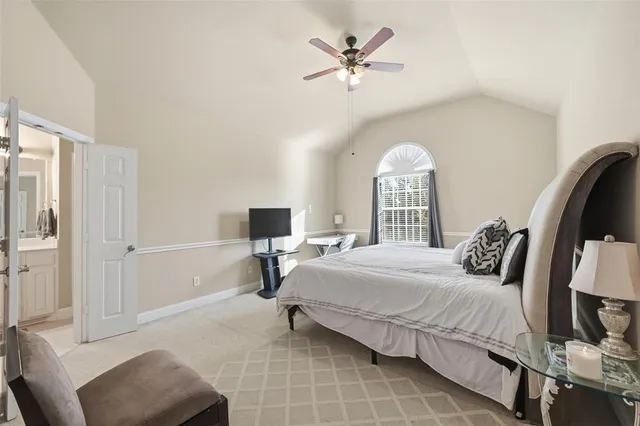 a bedroom with a bed and a chair