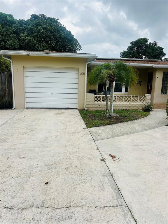 6624 Northwest 1st Court Margate, FL 33063 - Photo 1 of 17 a front view of house with yard