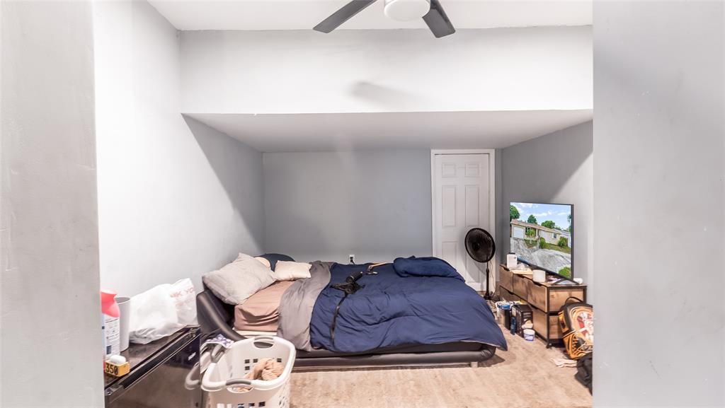 6624 Northwest 1st Court Margate, FL 33063 - Photo 15 of 17 a bed sitting in a bedroom next to a lamp