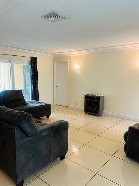 6624 Northwest 1st Court Margate, FL 33063 - Photo 6 of 17 a living room with furniture and kitchen