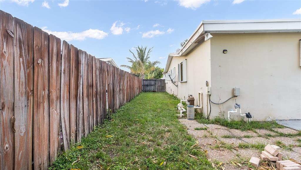 6624 Northwest 1st Court Margate, FL 33063 - Photo 7 of 17 a backyard of a house