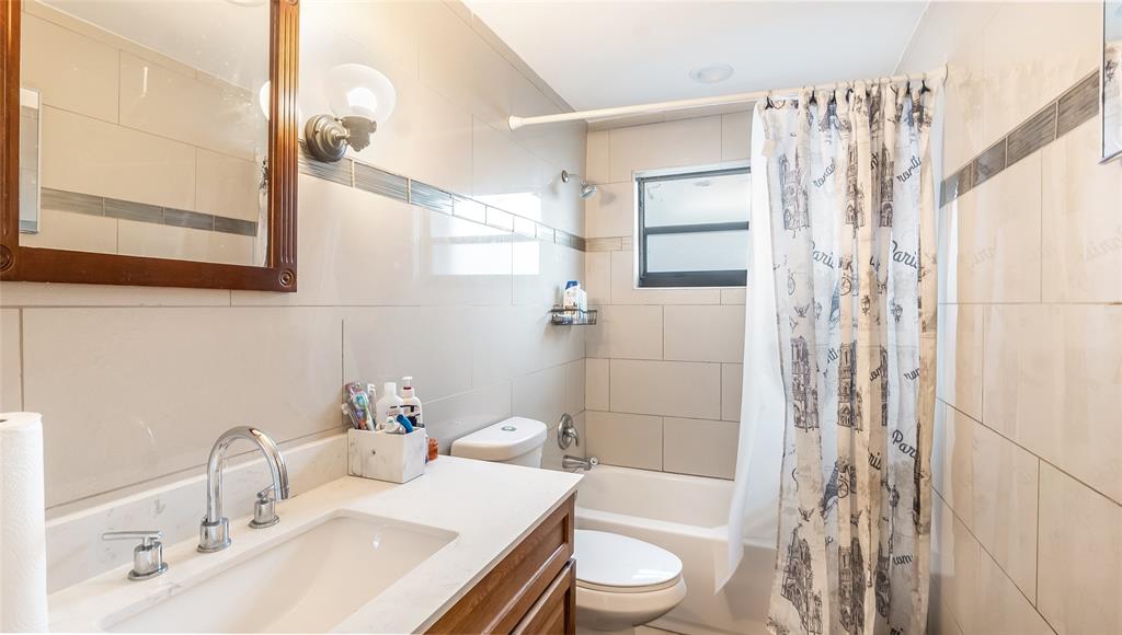 6624 Northwest 1st Court Margate, FL 33063 - Photo 8 of 17 a bathroom with a sink a toilet and shower