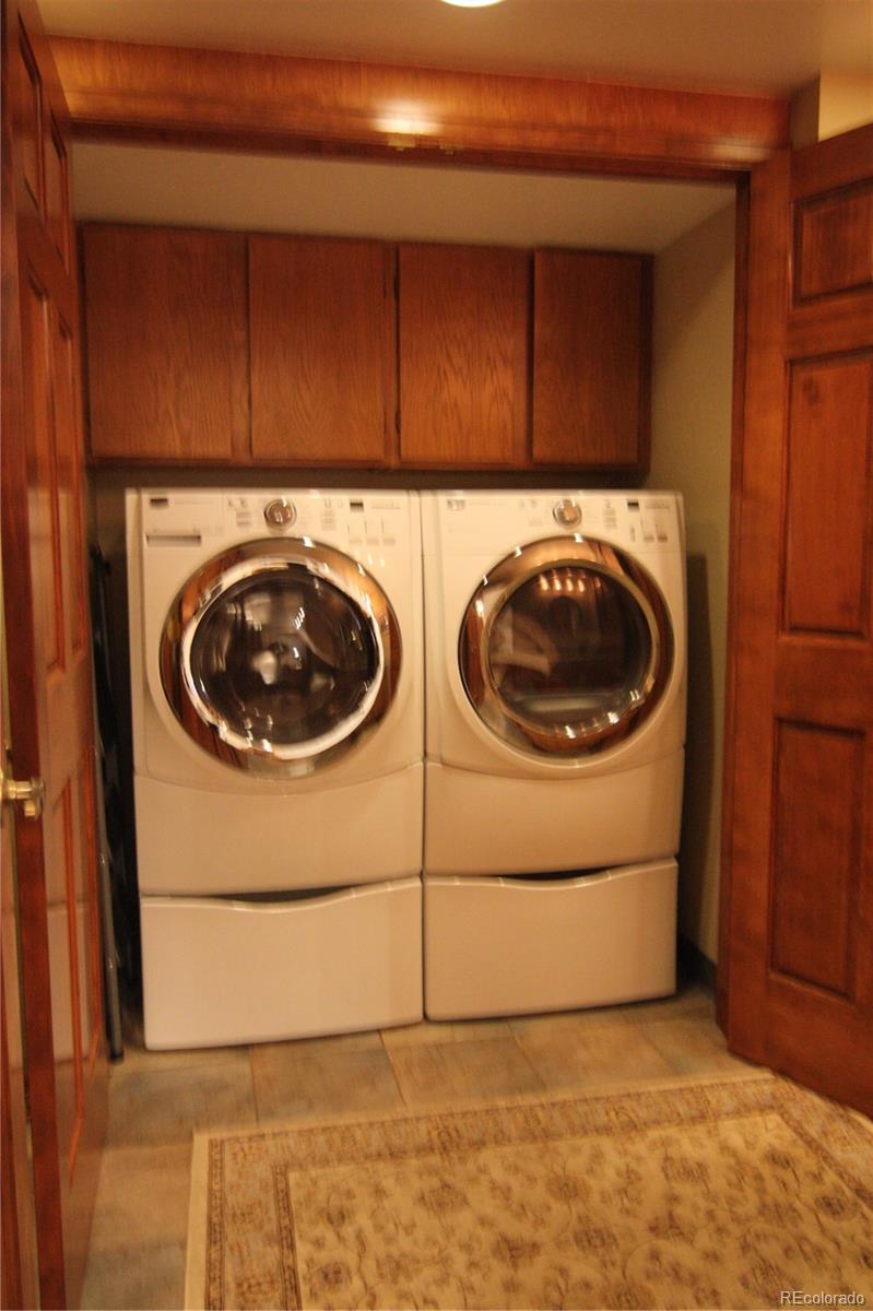 8435 Sweet Water Road Lone Tree, CO 80124 - Photo 12 of 24 a utility room with dryer and washer