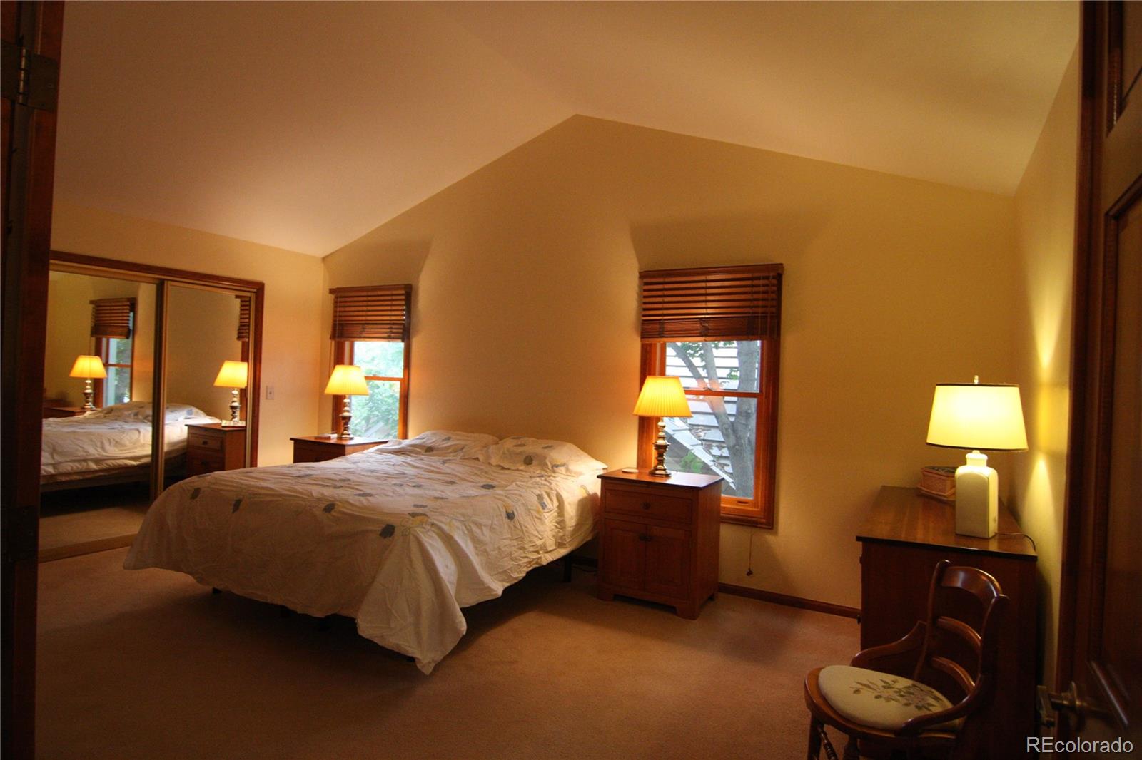 8435 Sweet Water Road Lone Tree, CO 80124 - Photo 14 of 24 a bedroom with a bed and window
