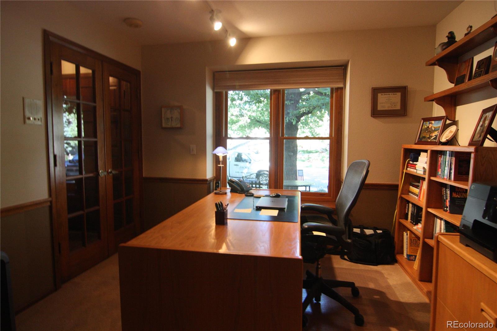 8435 Sweet Water Road Lone Tree, CO 80124 - Photo 22 of 24 a view of a workspace with furniture and a window