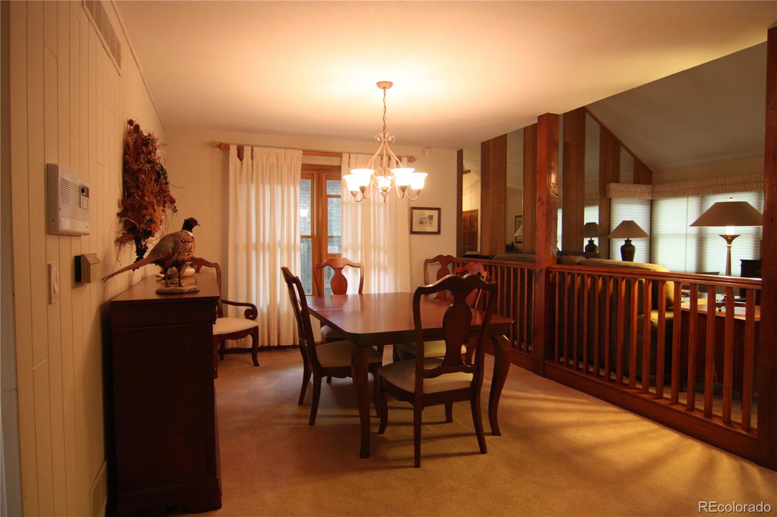 8435 Sweet Water Road Lone Tree, CO 80124 - Photo 7 of 24 a view of a dining room with furniture window and outside view