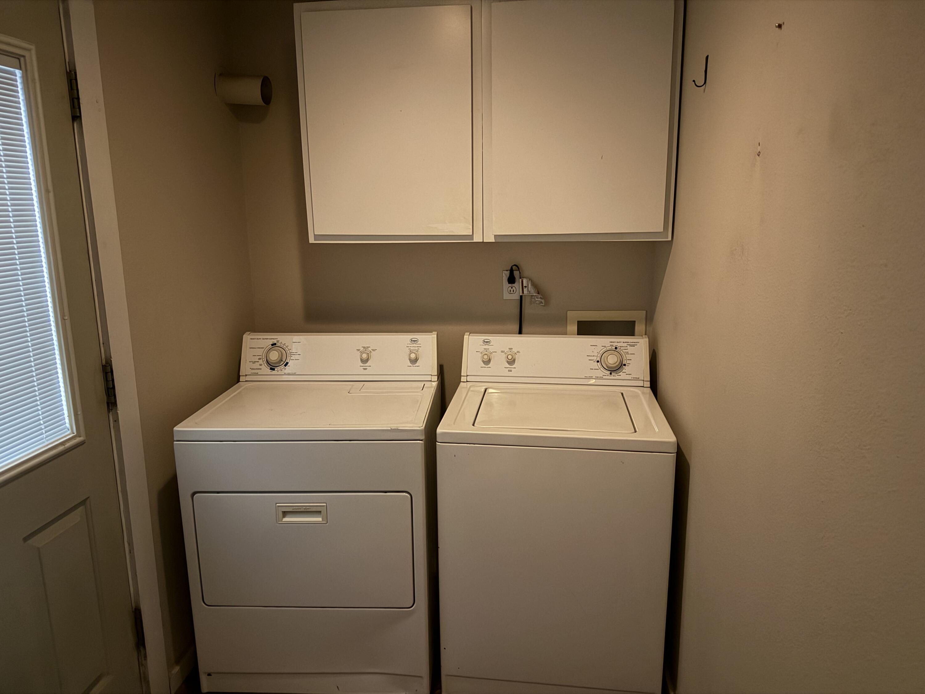 3110 22nd Street Lubbock, TX 79410 - Photo 15 of 22 a utility room with dryer and washer