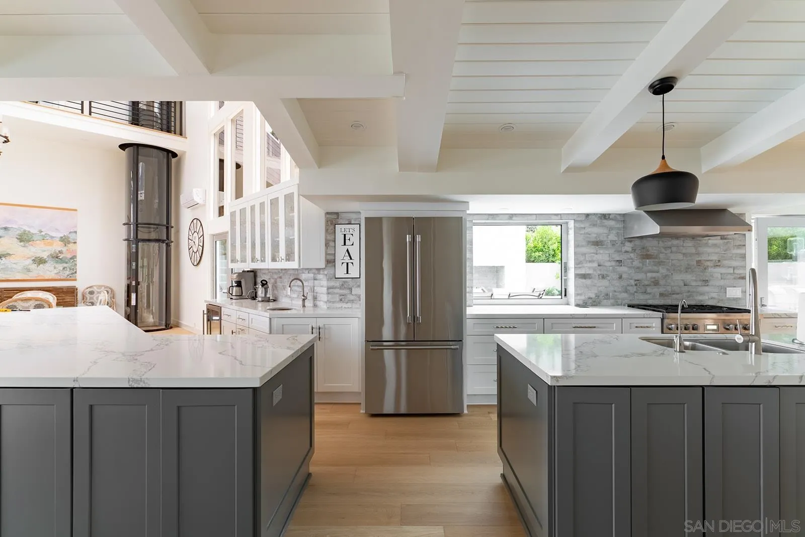 390 Hidden Pines Road Del Mar, CA 92014 - Photo 14 of 46 a kitchen with stainless steel appliances granite countertop a sink a refrigerator and a stove