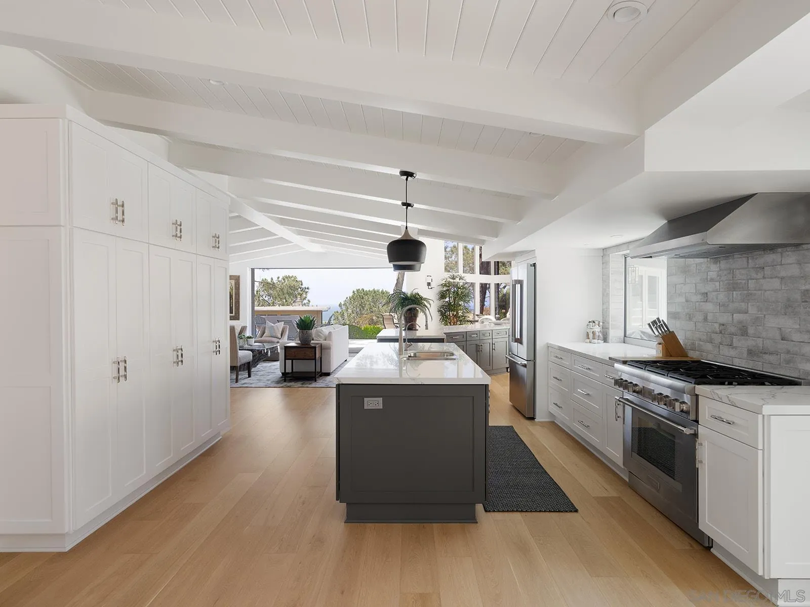 390 Hidden Pines Road Del Mar, CA 92014 - Photo 15 of 46 a kitchen with stainless steel appliances granite countertop a stove and cabinets