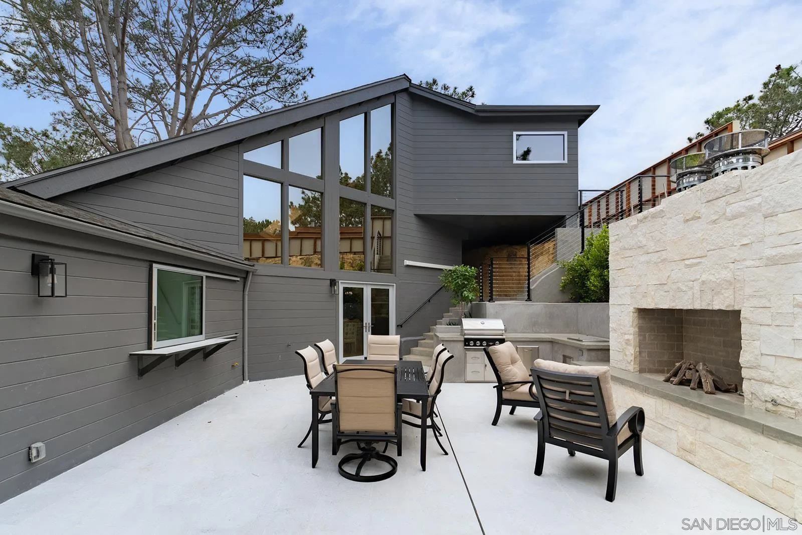 390 Hidden Pines Road Del Mar, CA 92014 - Photo 21 of 46 a front view of a house with outdoor seating