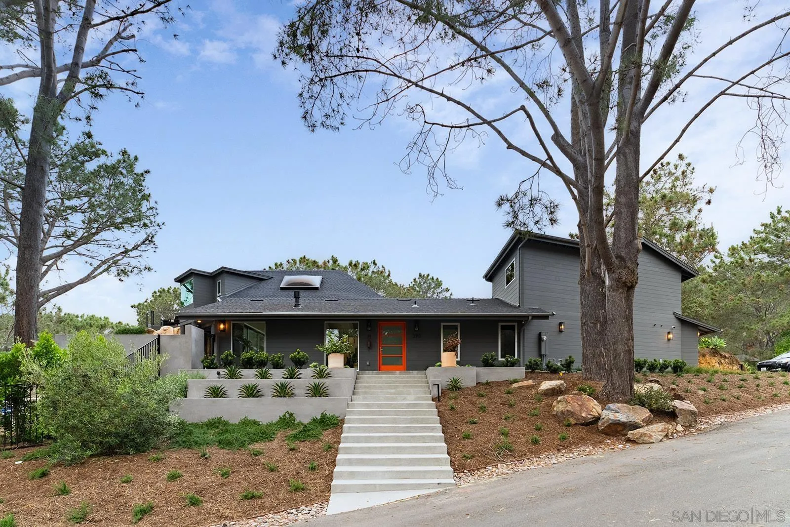 390 Hidden Pines Road Del Mar, CA 92014 - Photo 3 of 46 a front view of a house with garden