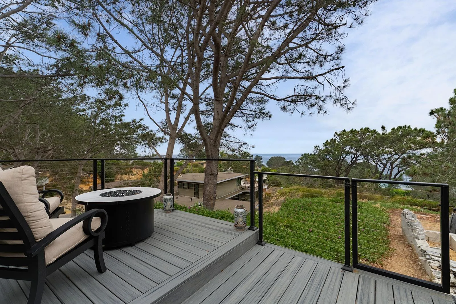 390 Hidden Pines Road Del Mar, CA 92014 - Photo 32 of 46 a balcony with wooden floor table and chairs