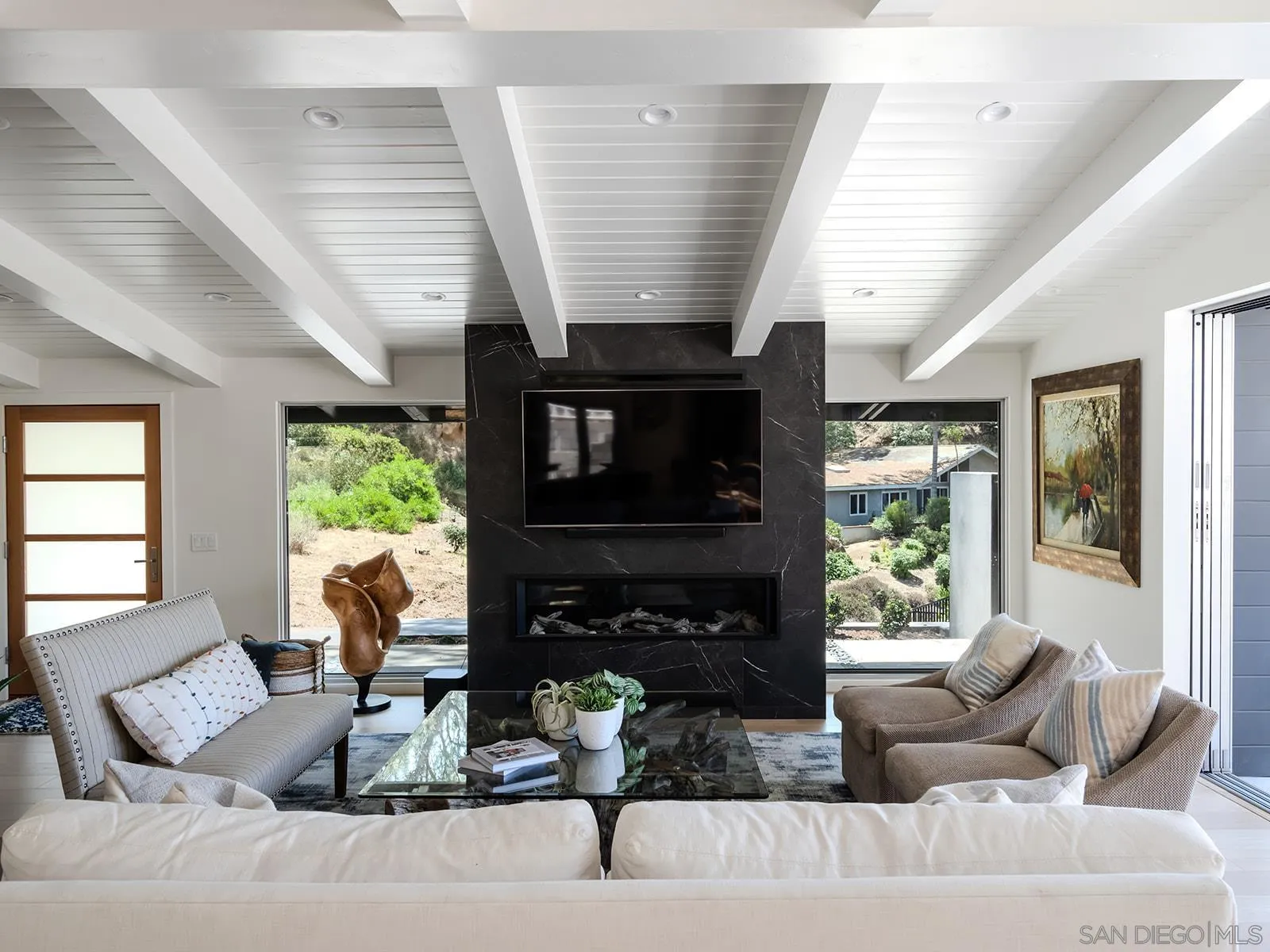 390 Hidden Pines Road Del Mar, CA 92014 - Photo 5 of 46 a living room with furniture and a fireplace