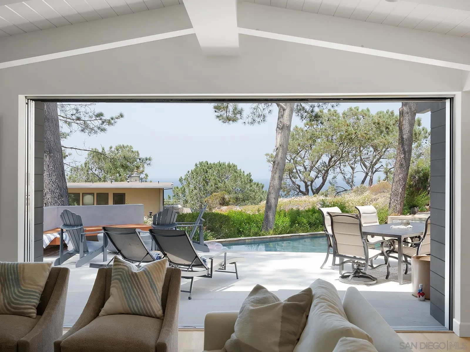 390 Hidden Pines Road Del Mar, CA 92014 - Photo 7 of 46 a living room with furniture and a large window