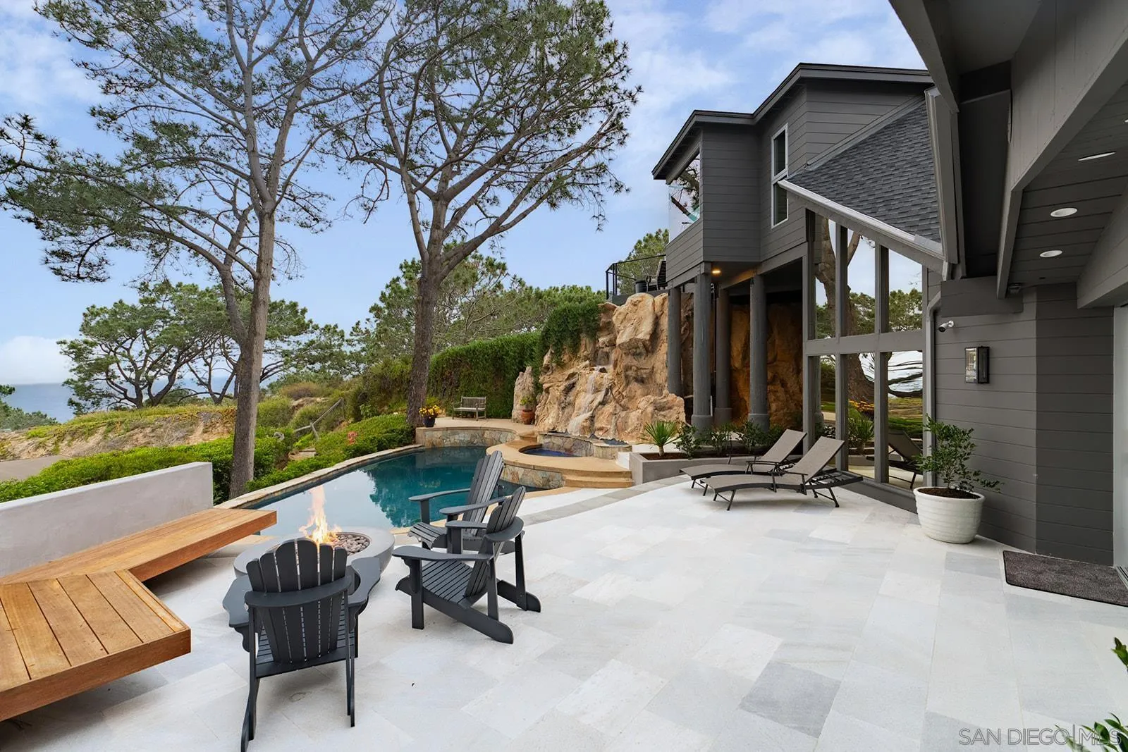 390 Hidden Pines Road Del Mar, CA 92014 - Photo 8 of 46 a view of a patio with a table and chairs