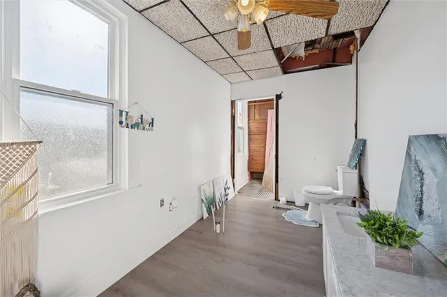 a view of an entryway with wooden floor