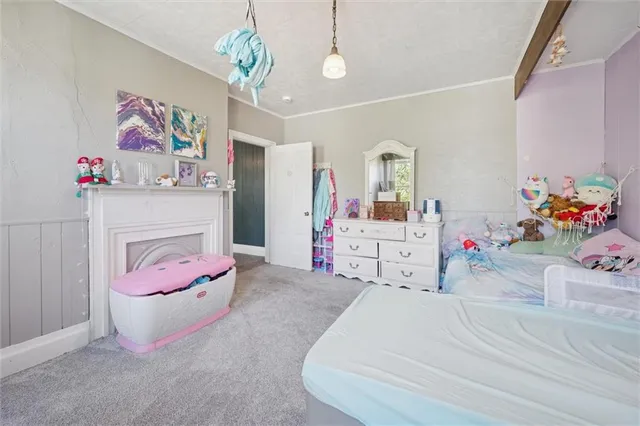 a bed room with a bed mirror and a window