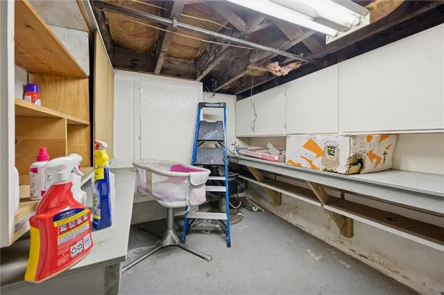 a utility room with furniture and toys