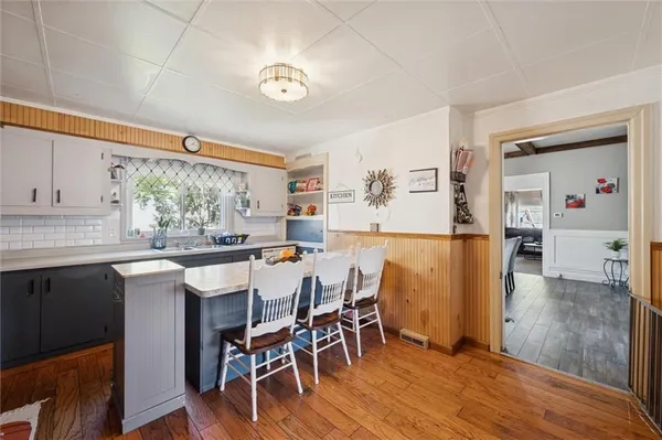 a kitchen with a table and chairs in it