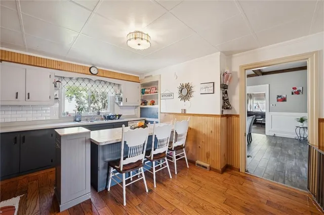 a kitchen with a table and chairs in it