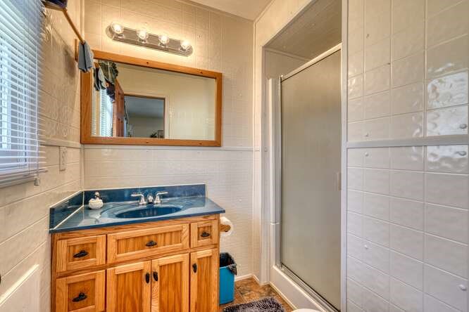 243 Allison Road Blairsville, GA 30512 - Photo 11 of 33 a bathroom with a sink and a granite countertop